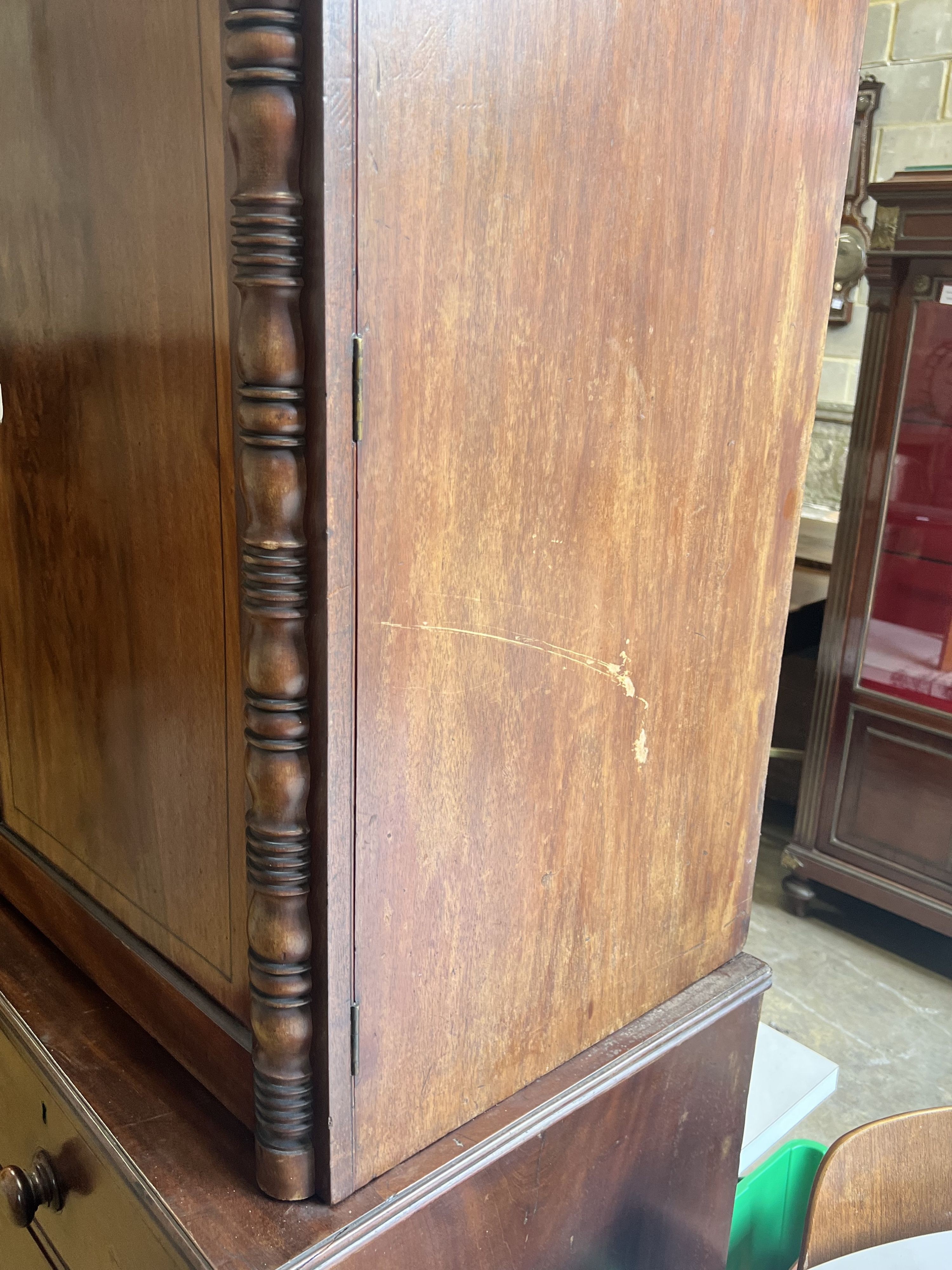 A Regency mahogany linen press, converted to a hanging wardrobe, width 122cm depth 55cm height 216cm